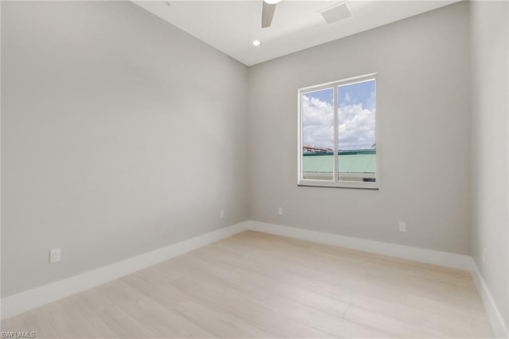 1395 Curlew Avenue, Unit 43 Naples, FL 34102 - Photo 16 of 31 an empty room with a window