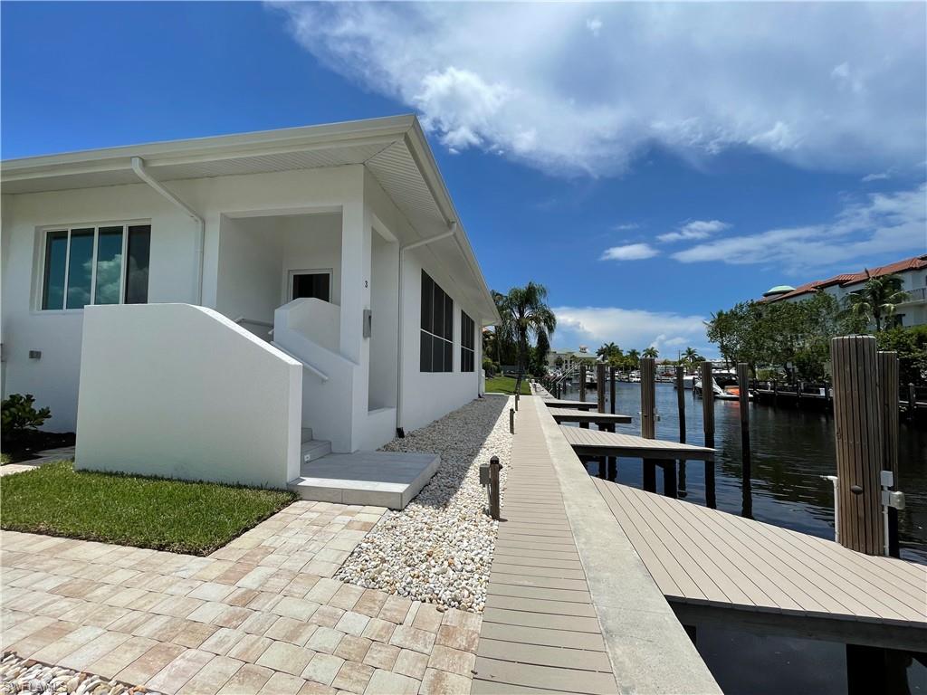 1395 Curlew Avenue, Unit 43 Naples, FL 34102 - Photo 2 of 31 a view of a house with a terrace