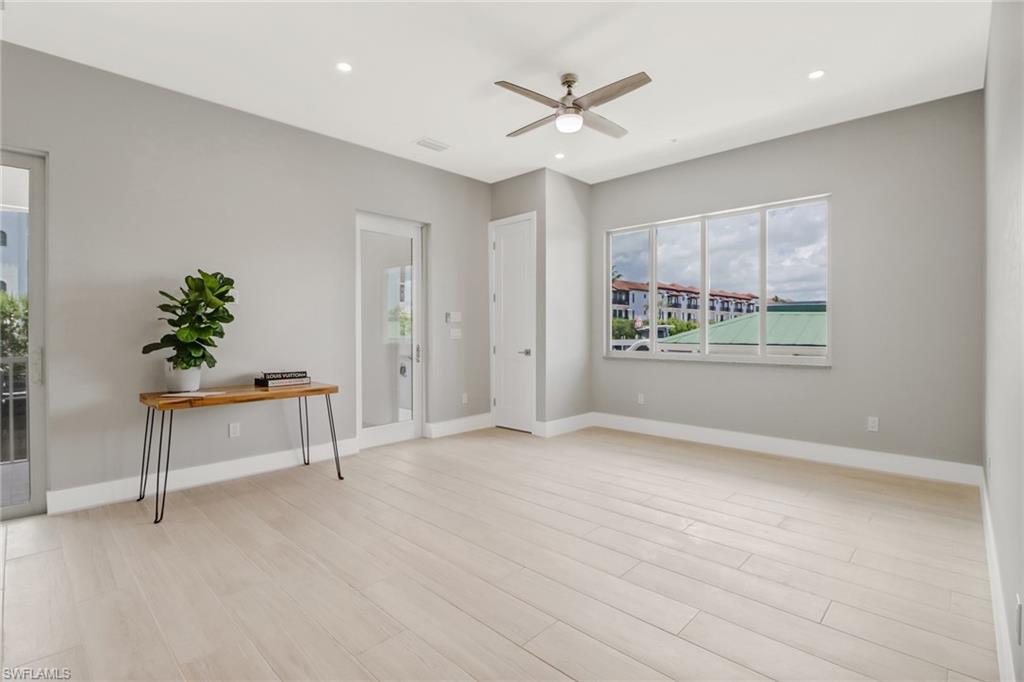1395 Curlew Avenue, Unit 43 Naples, FL 34102 - Photo 7 of 31 an empty room with windows and fan