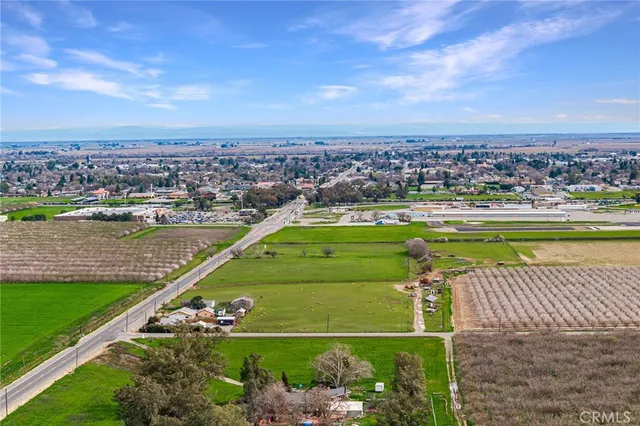 an aerial view of a city with a lake view