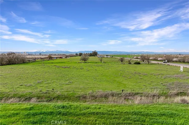 a view of a lake with houses in the back