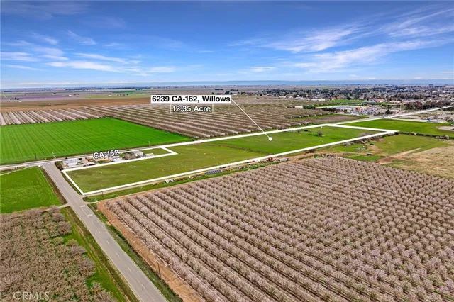 a view of a tennis court with an ocean view