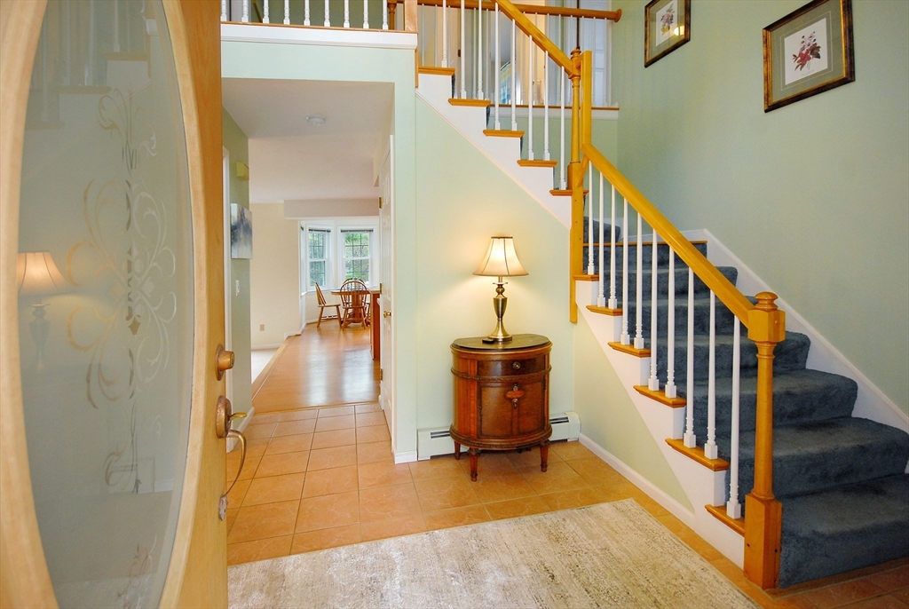 257 North Road Sudbury, MA 01776 - Photo 9 of 30 a view of an entryway with wooden floor and a livingroom view