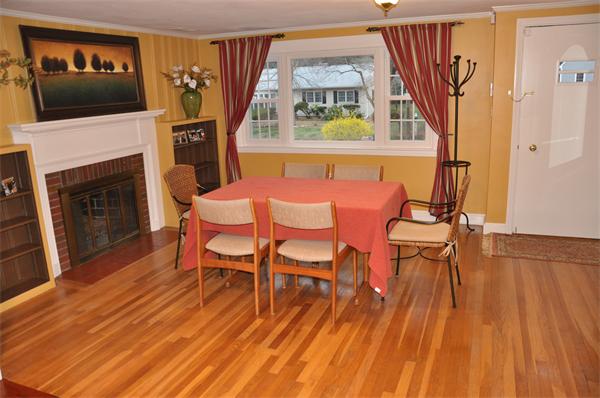 54 Nancy Road Concord, MA 01742 - Photo 6 of 16 a view of a livingroom with furniture and a fireplace