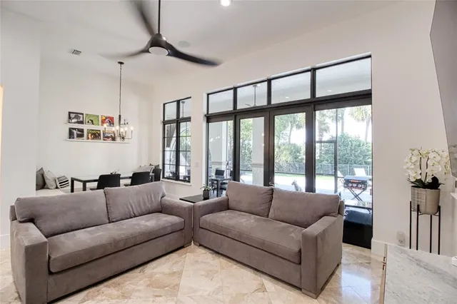 a bedroom with a large bed and a large window