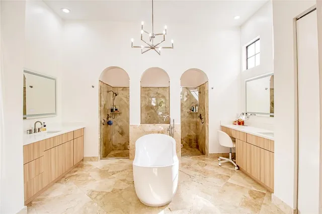 a view of a hallway with wooden floor and windows
