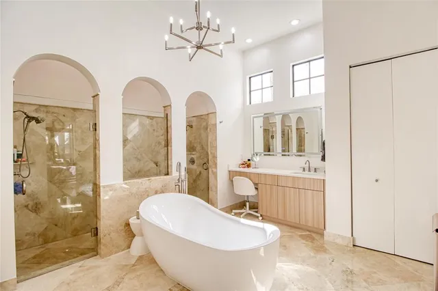 a bathroom with a sink mirror and window