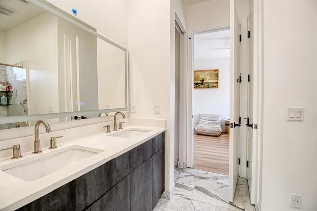 a bedroom with a bed and a desk