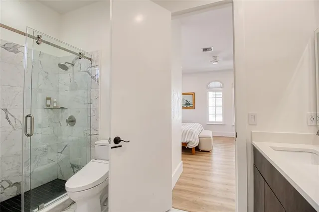 a bedroom with a baby bed and dresser