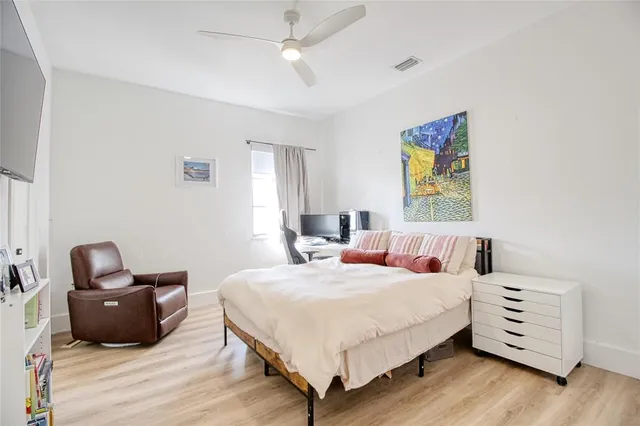 a bathroom with a double vanity sink a mirror and a bathtub