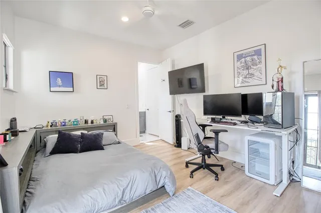 a view of a park with a large trees