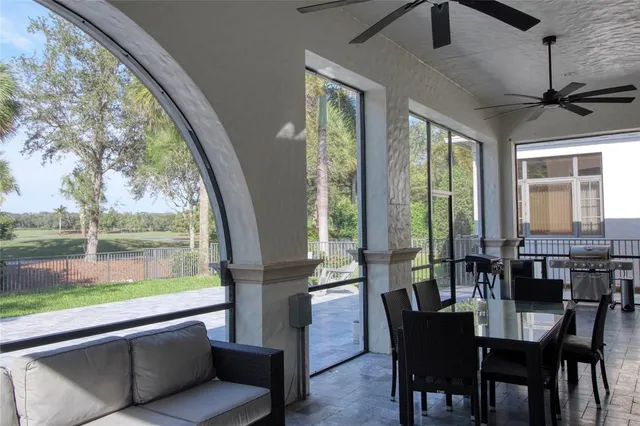 a view of a swimming pool with an outdoor space and seating area