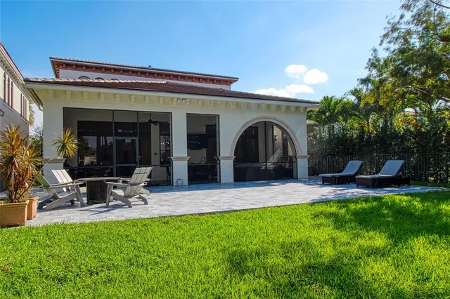 a view of a swimming pool with an outdoor seating