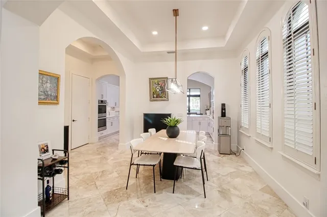 a living room with furniture a rug and a chandelier