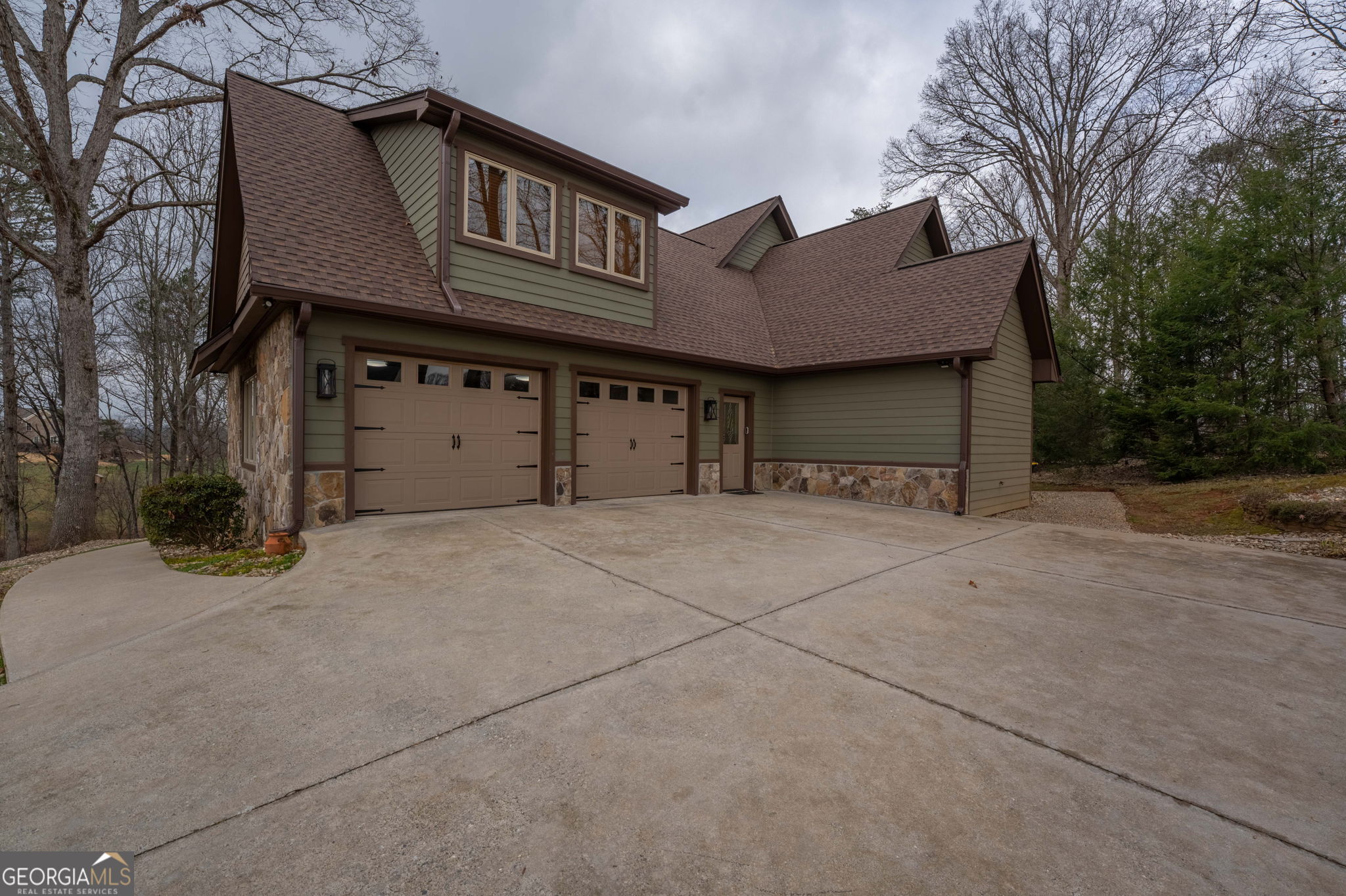 712 Meadow Run Court Clarkesville, GA 30523 - Photo 83 of 96 a front view of a house with a yard and garage
