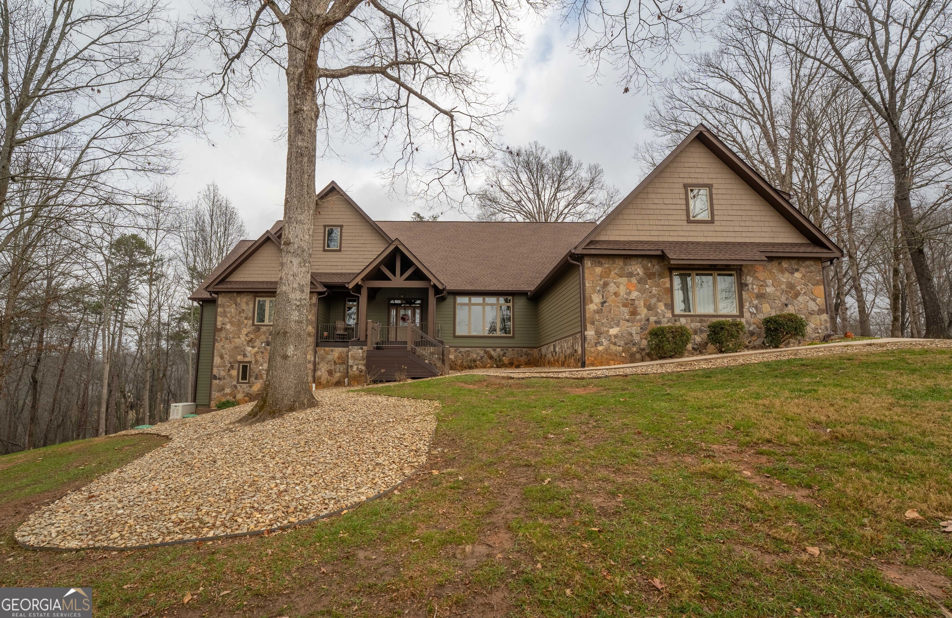 712 Meadow Run Court Clarkesville, GA 30523 - Photo 95 of 96 a front view of a house with a yard and garage