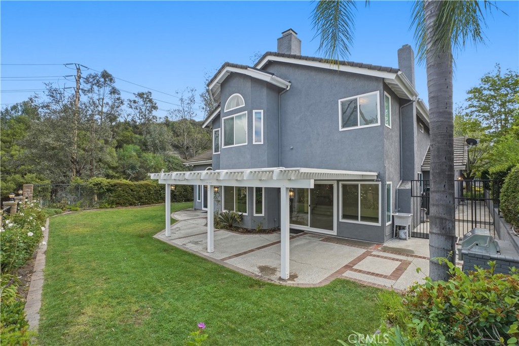 3537 Foxglove Road Glendale, CA 91206 - Photo 16 of 73 a view of a house with a yard and a garden