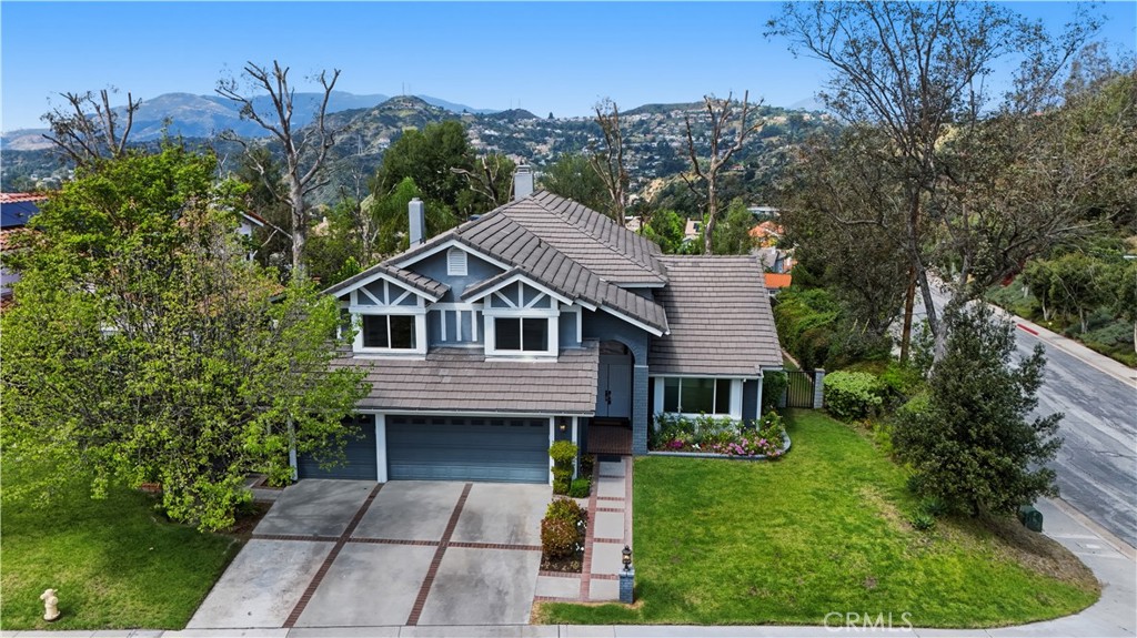 3537 Foxglove Road Glendale, CA 91206 - Photo 2 of 73 a front view of a house with a garden