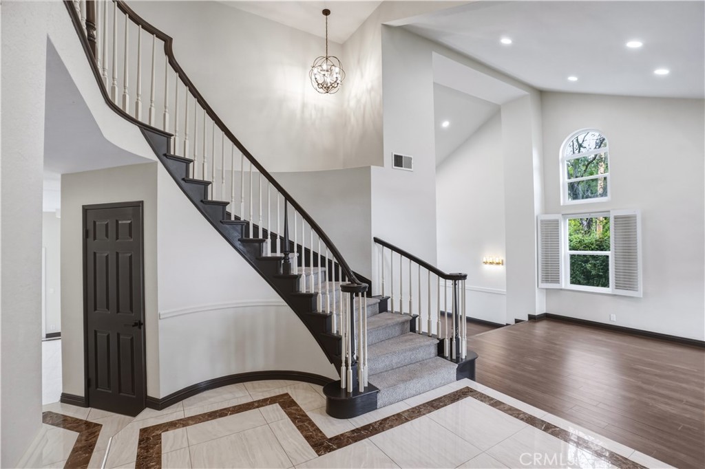 3537 Foxglove Road Glendale, CA 91206 - Photo 21 of 73 wooden floor with staircase and windows
