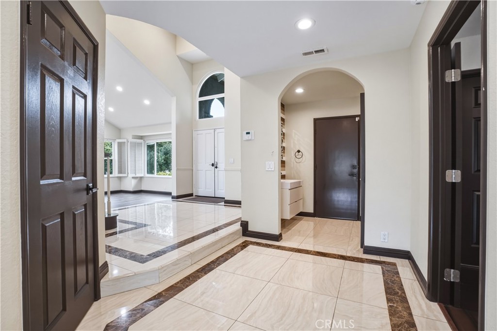 3537 Foxglove Road Glendale, CA 91206 - Photo 24 of 73 a view of a hallway with wooden floor and staircase