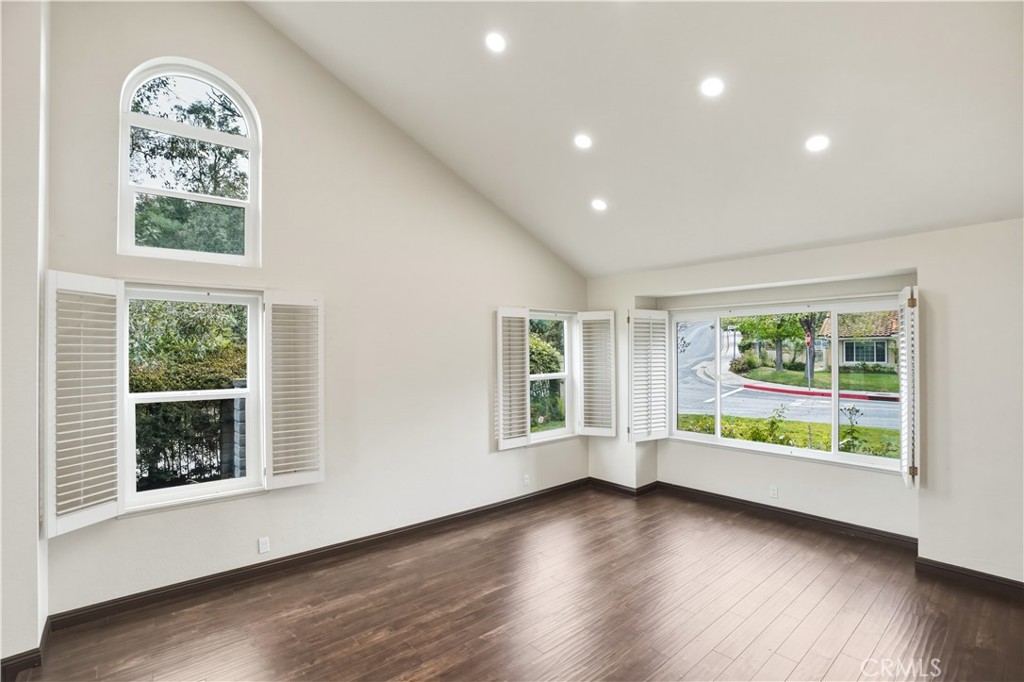 3537 Foxglove Road Glendale, CA 91206 - Photo 29 of 73 an empty room with wooden floor and windows