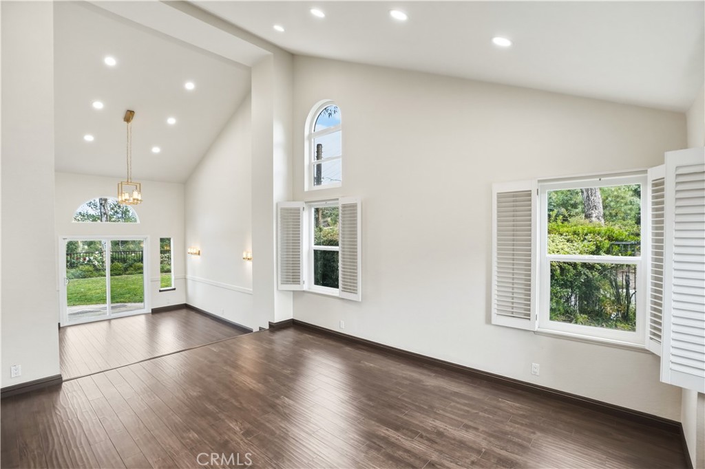 3537 Foxglove Road Glendale, CA 91206 - Photo 31 of 73 an empty room with wooden floor and windows