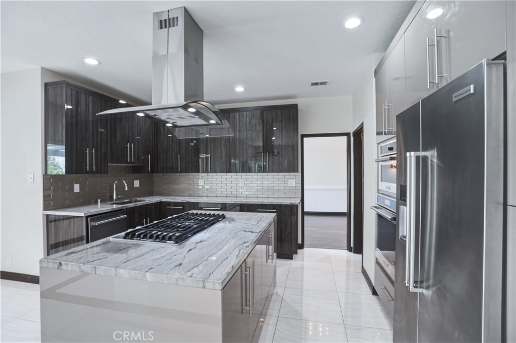 3537 Foxglove Road Glendale, CA 91206 - Photo 33 of 73 a kitchen with a refrigerator and a sink