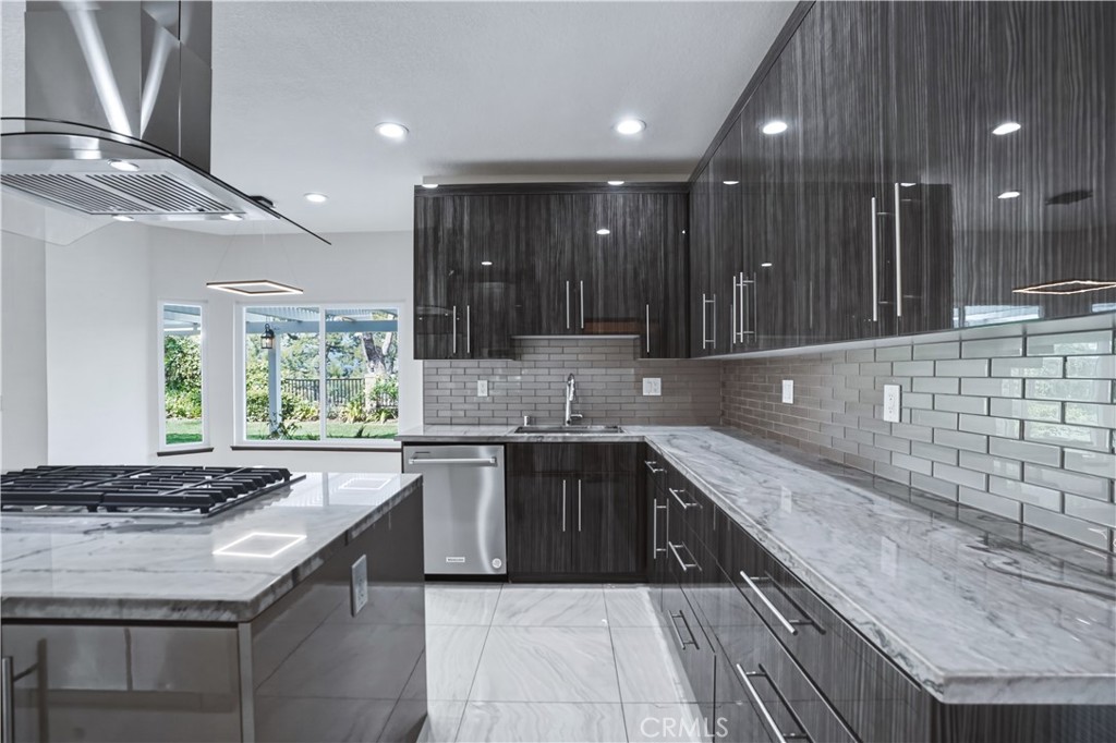 3537 Foxglove Road Glendale, CA 91206 - Photo 34 of 73 a large kitchen with granite countertop a sink and cabinets