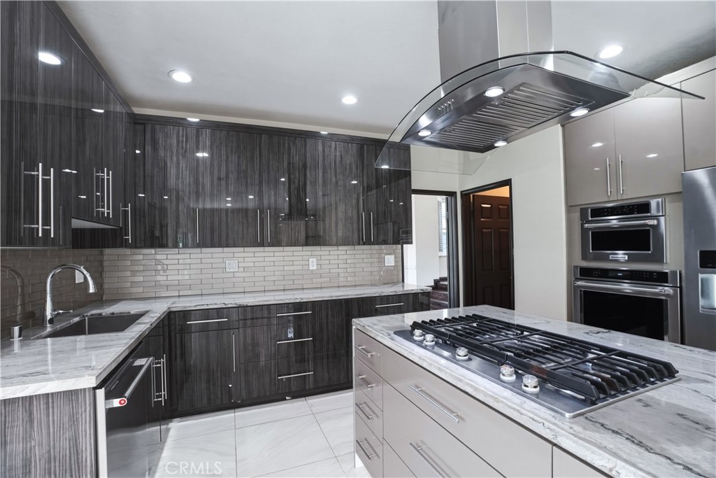 3537 Foxglove Road Glendale, CA 91206 - Photo 35 of 73 a kitchen with stainless steel appliances granite countertop a sink stove and refrigerator