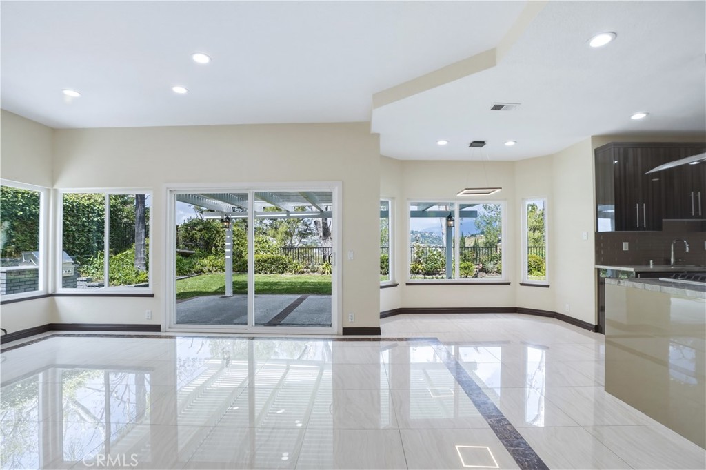 3537 Foxglove Road Glendale, CA 91206 - Photo 38 of 73 a view of an empty room with wooden floor and a window