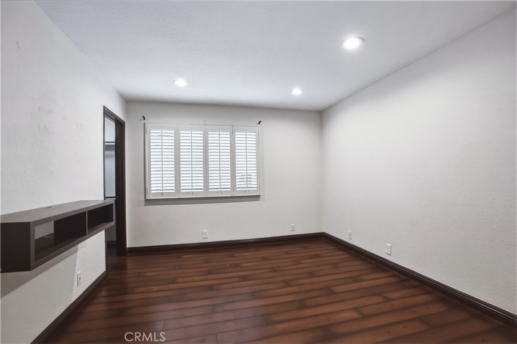 3537 Foxglove Road Glendale, CA 91206 - Photo 46 of 73 a view of an empty room with wooden floor and a window