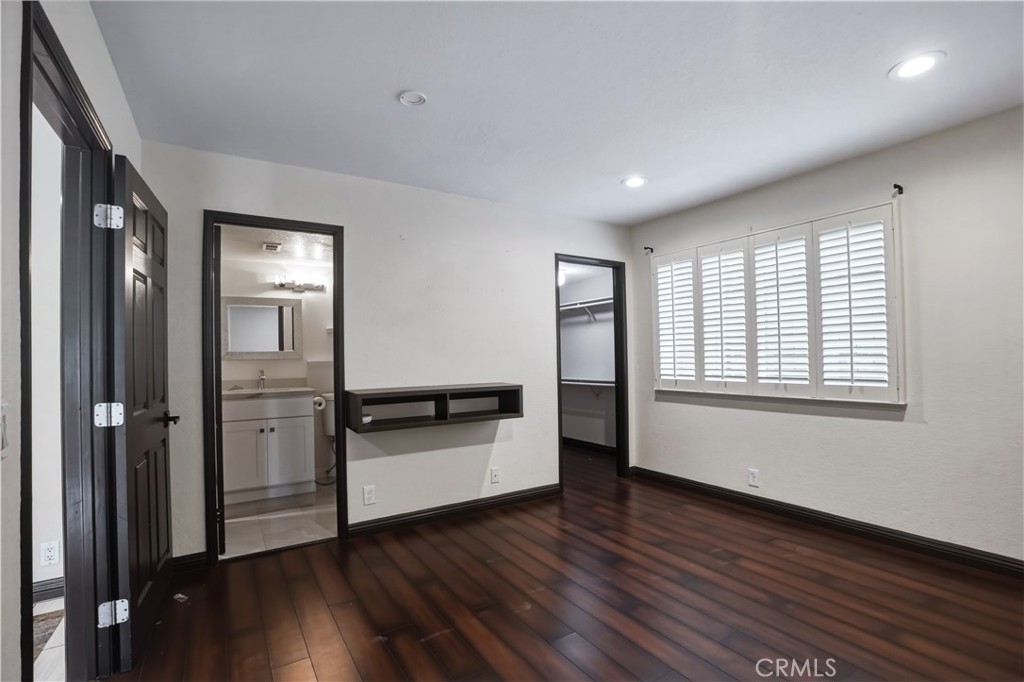 3537 Foxglove Road Glendale, CA 91206 - Photo 47 of 73 a view of a room with wooden floor electronic appliances and windows