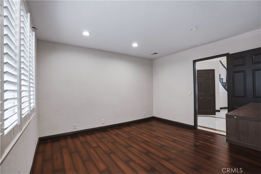3537 Foxglove Road Glendale, CA 91206 - Photo 49 of 73 a view of empty room with wooden floor and fan