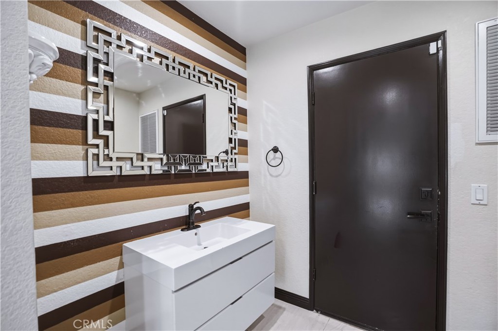 3537 Foxglove Road Glendale, CA 91206 - Photo 53 of 73 a bathroom with a sink and a mirror