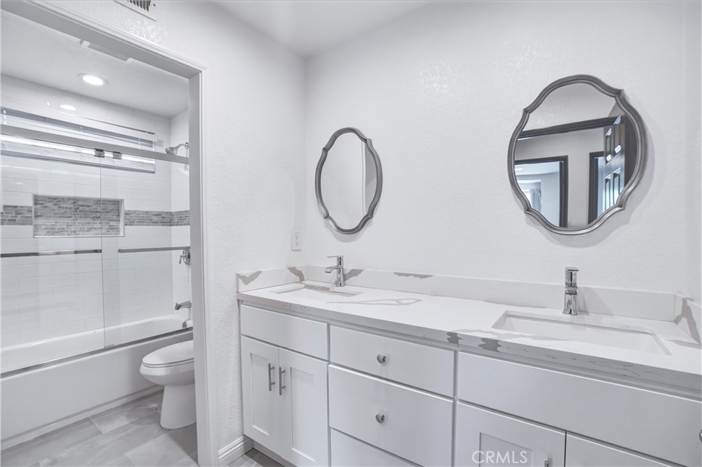 3537 Foxglove Road Glendale, CA 91206 - Photo 64 of 73 a bathroom with a toilet a sink and mirror
