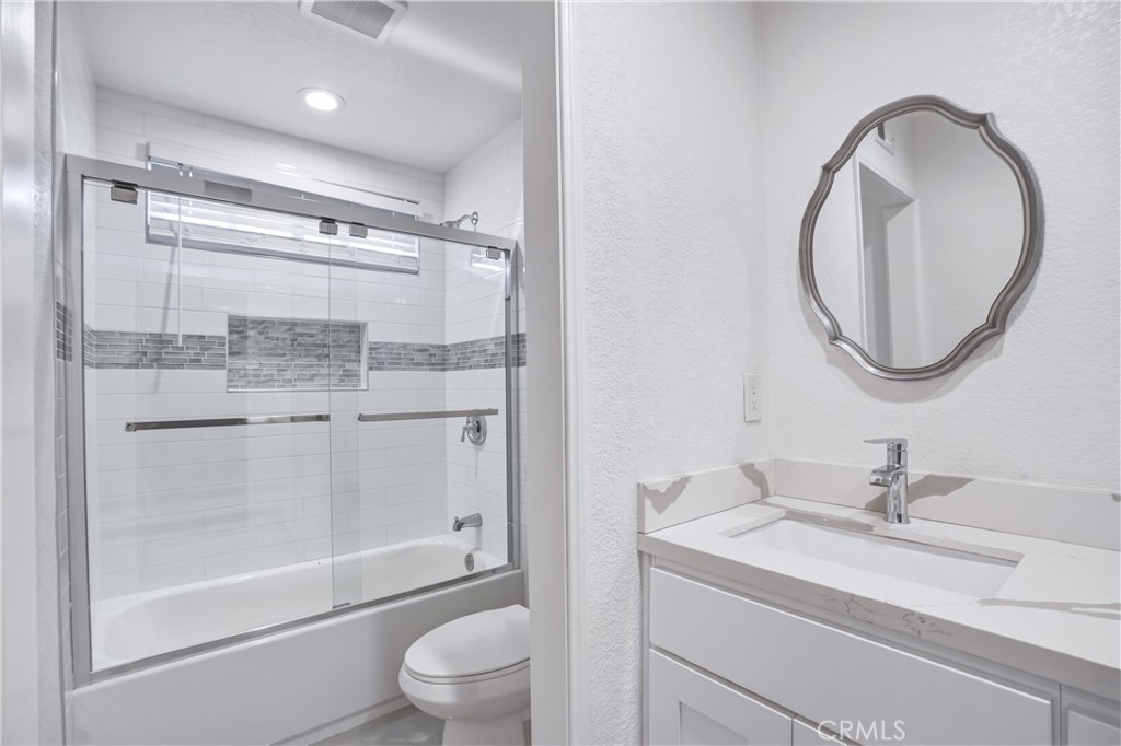 3537 Foxglove Road Glendale, CA 91206 - Photo 65 of 73 a bathroom with a granite countertop sink a toilet and shower