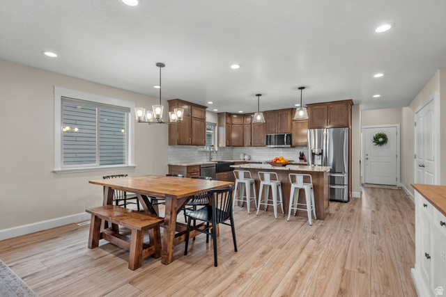 1896 West 800 North Mapleton, UT 84663 - Photo 7 of 55 Dining room with light wood-style flooring and a chandelier