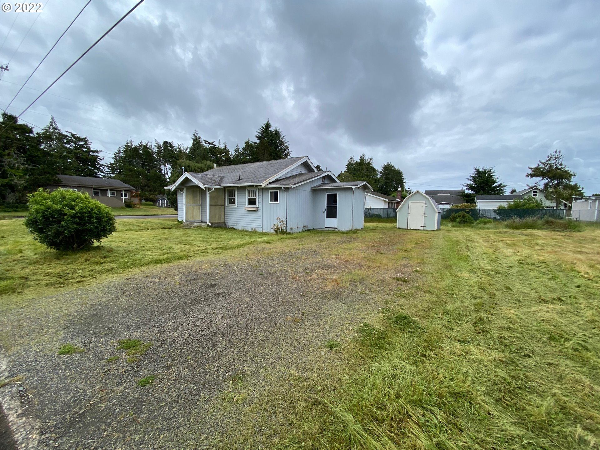 1184 2nd Street Florence, OR 97439 - Photo 3 of 4 a view of a house with a yard