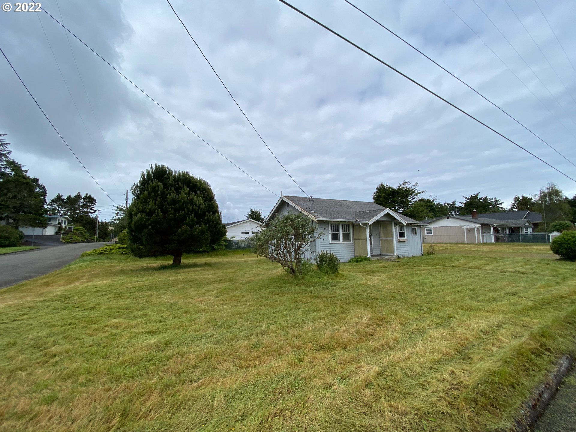 1184 2nd Street Florence, OR 97439 - Photo 4 of 4 a front view of a house with a yard