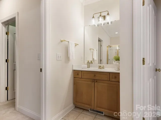 a bathroom with a double vanity sink and a mirror