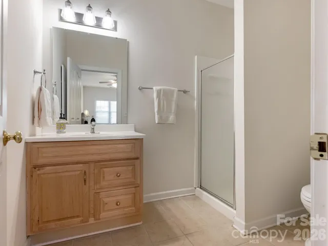 a spacious bedroom with a bed and a window