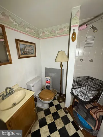 a view of a brick house with wooden wall