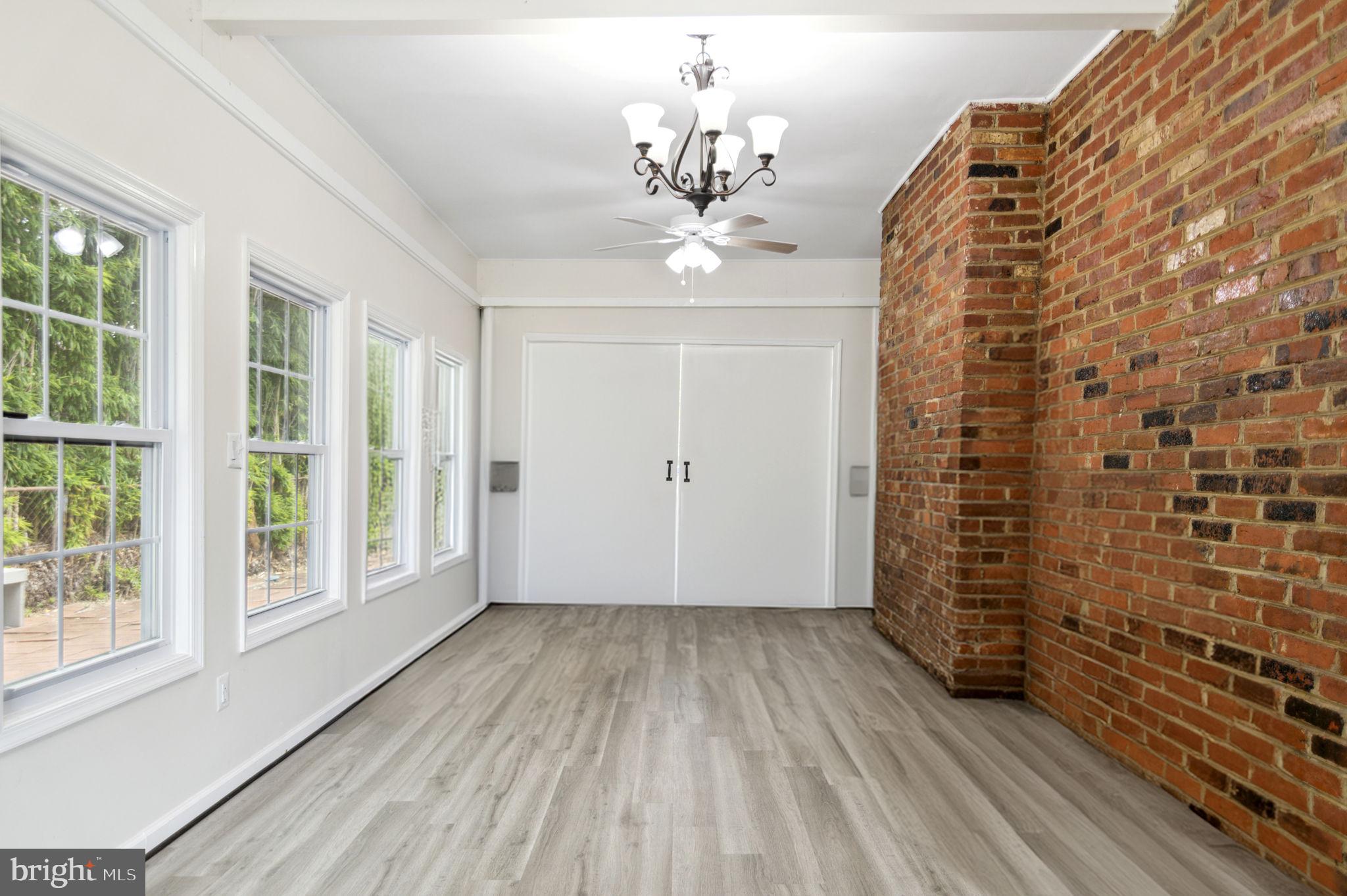 6001 Brandon Avenue Springfield, VA 22150 - Photo 36 of 65 wooden floor in an empty room with a window