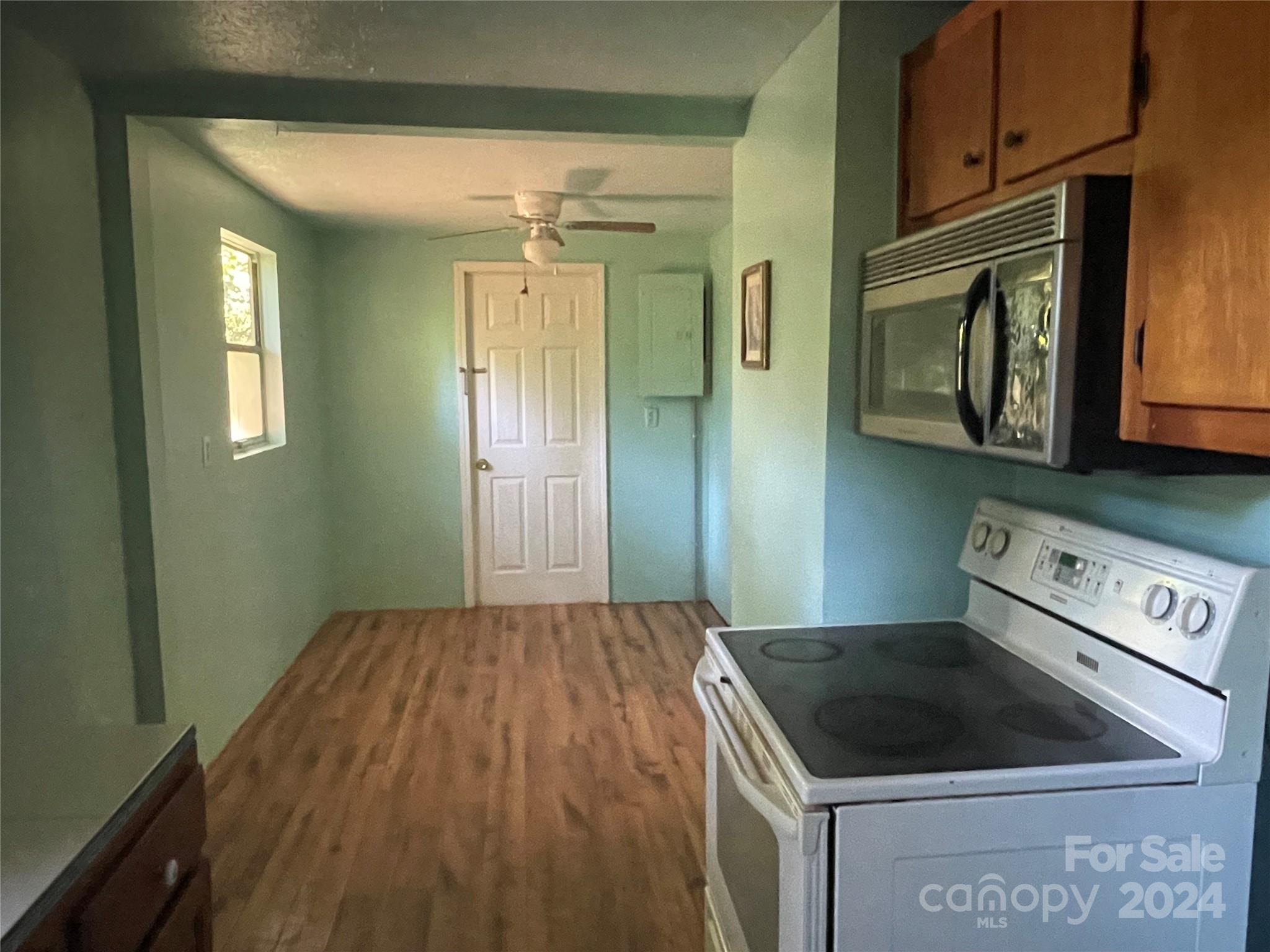 77 Medford Road Tryon, NC 28782 - Photo 31 of 48 a kitchen with a stove and a microwave