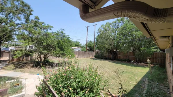 a view of a house with a small yard