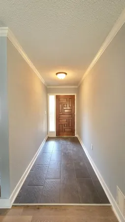 a view of an empty room and window
