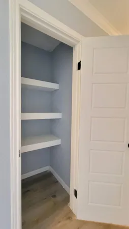 a view of an empty walk in closet