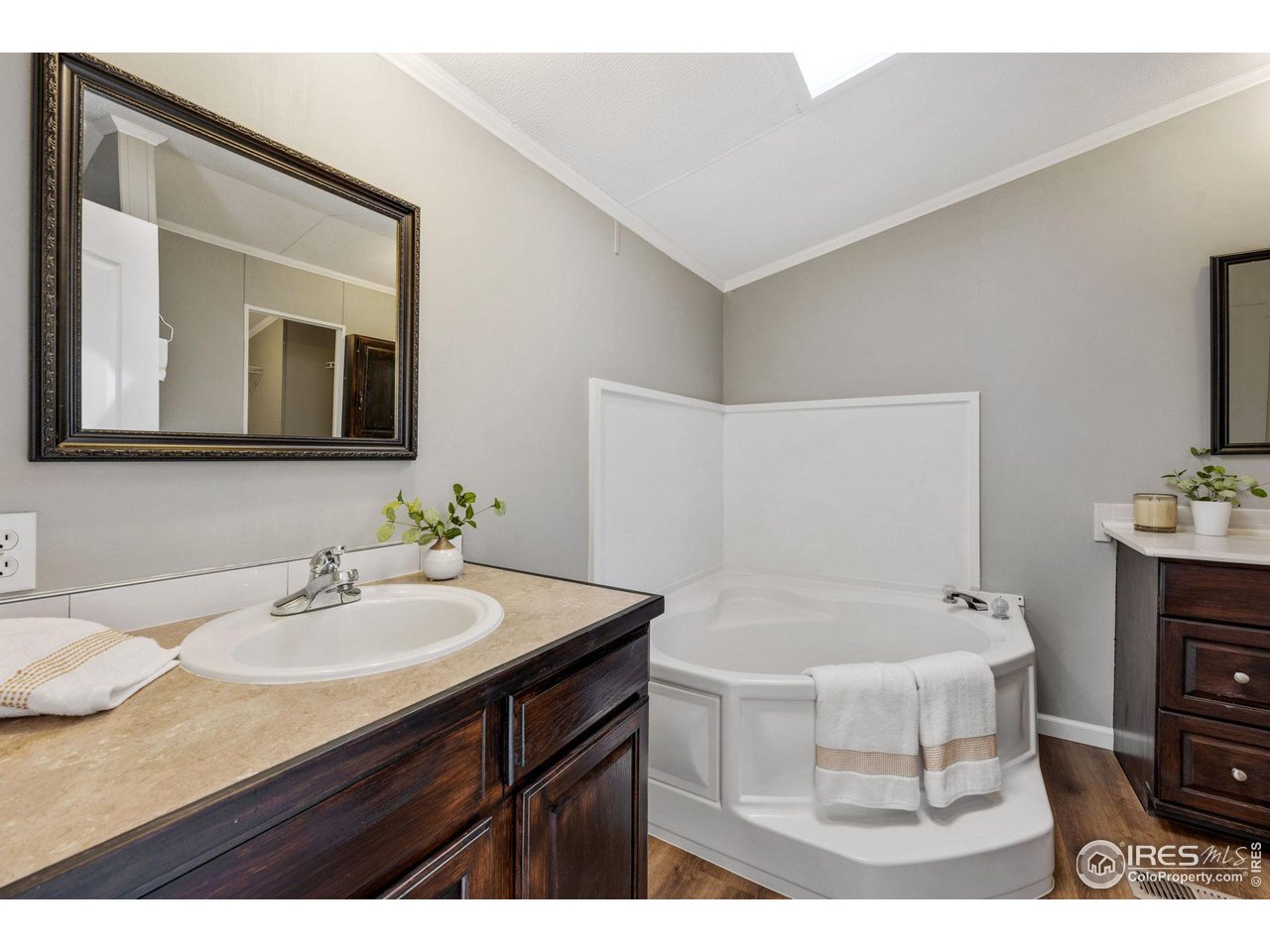 517 East Trilby Road, Unit 102 Fort Collins, CO 80525 - Photo 11 of 19 a bathroom with a sink and a mirror