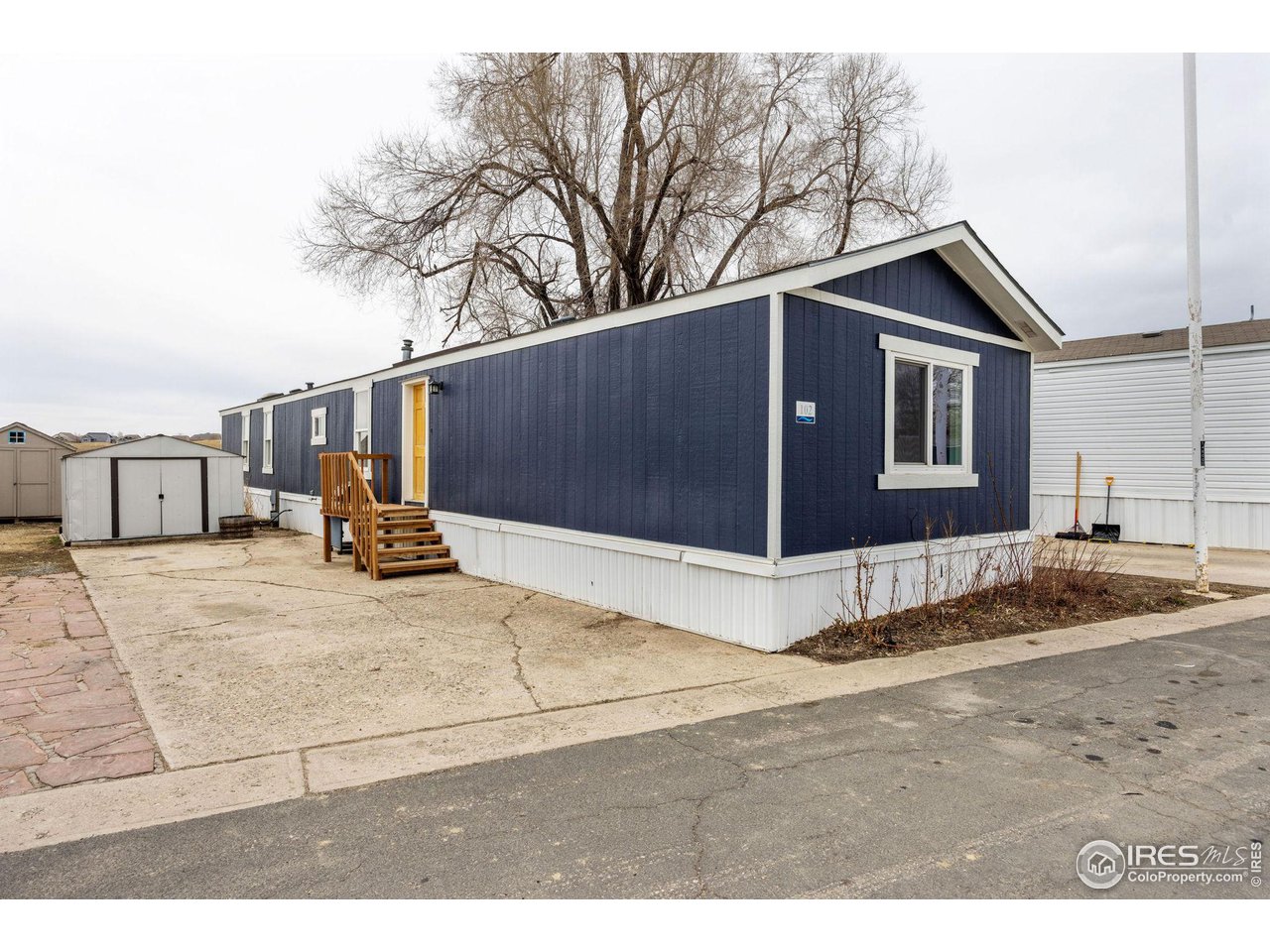 517 East Trilby Road, Unit 102 Fort Collins, CO 80525 - Photo 2 of 19 a house view with a outdoor space
