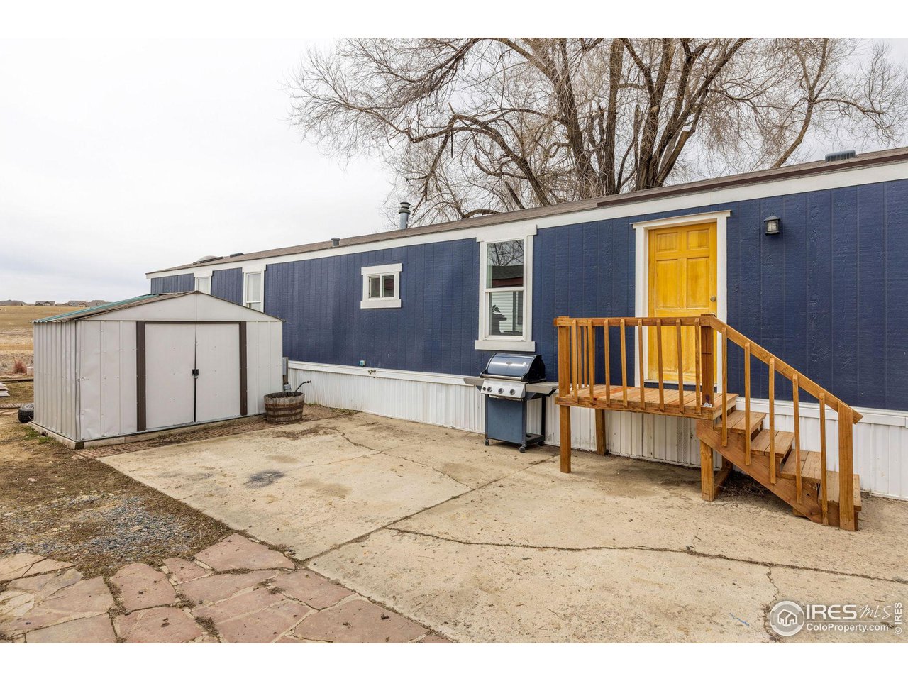 517 East Trilby Road, Unit 102 Fort Collins, CO 80525 - Photo 3 of 19 a view of a house with a outdoor space